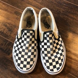 White and black checkered slip on vans